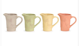 Just because lilies bouquet in Pitcher vase